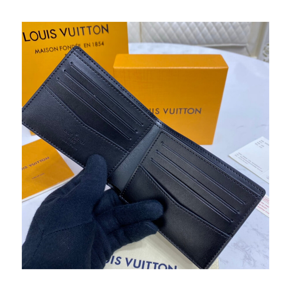 Louis Vuitton Monogram Seal Cowhide Leather Slender Wallet M80520