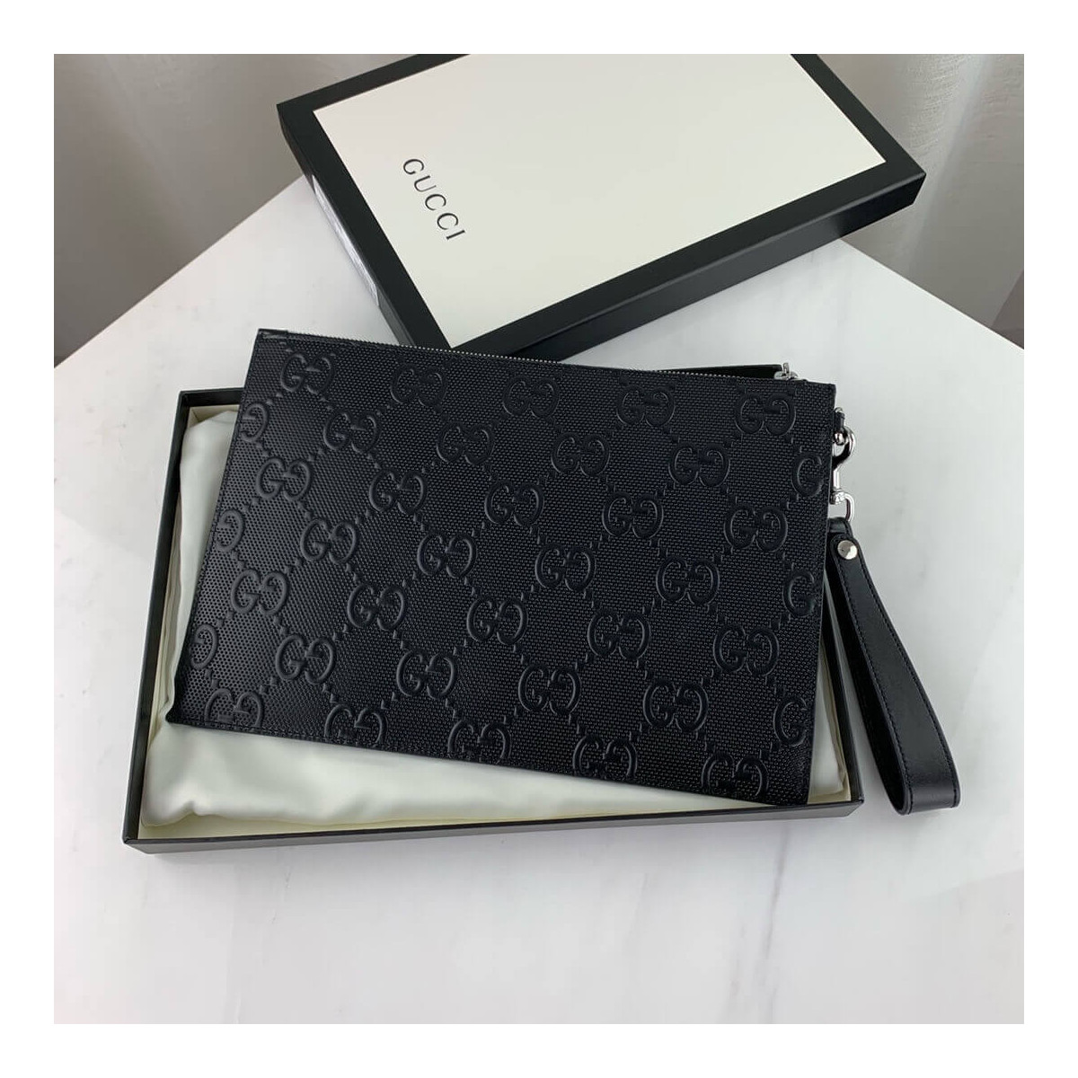 Gucci GG Embossed Pouch 625569