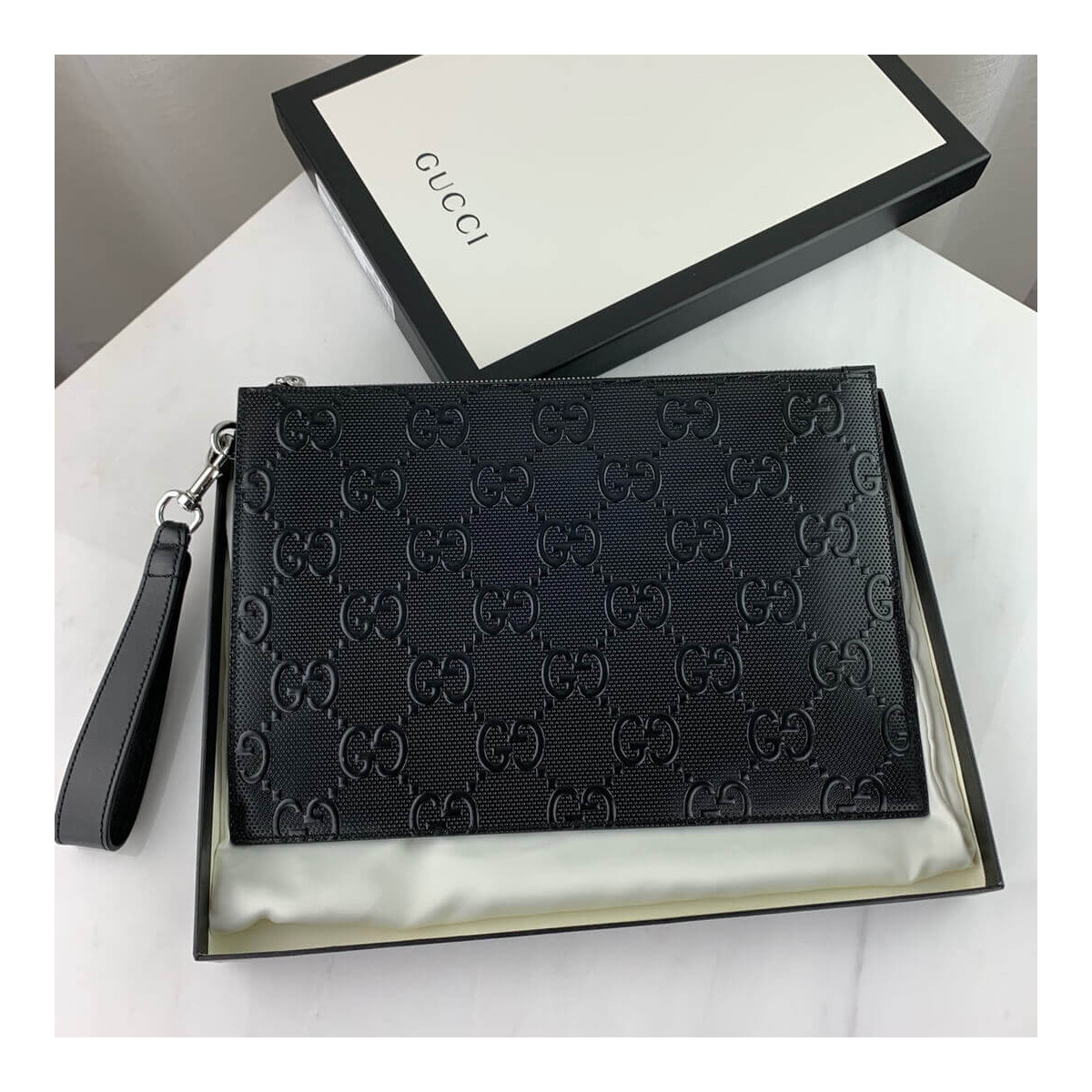 Gucci GG Embossed Pouch 625569