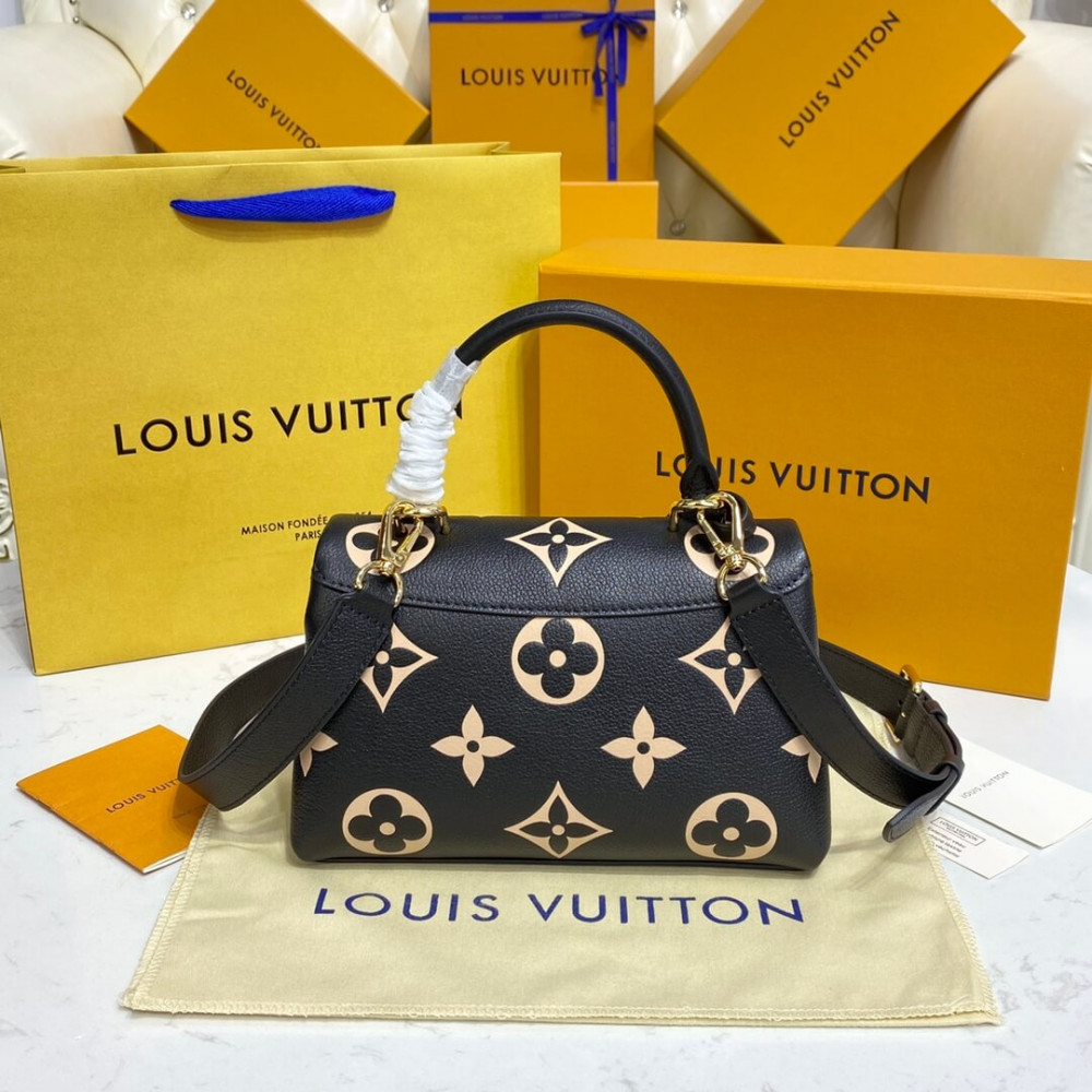 Louis Vuitton Bicolor Monogram Empreinte Leather Madeleine BB M45978