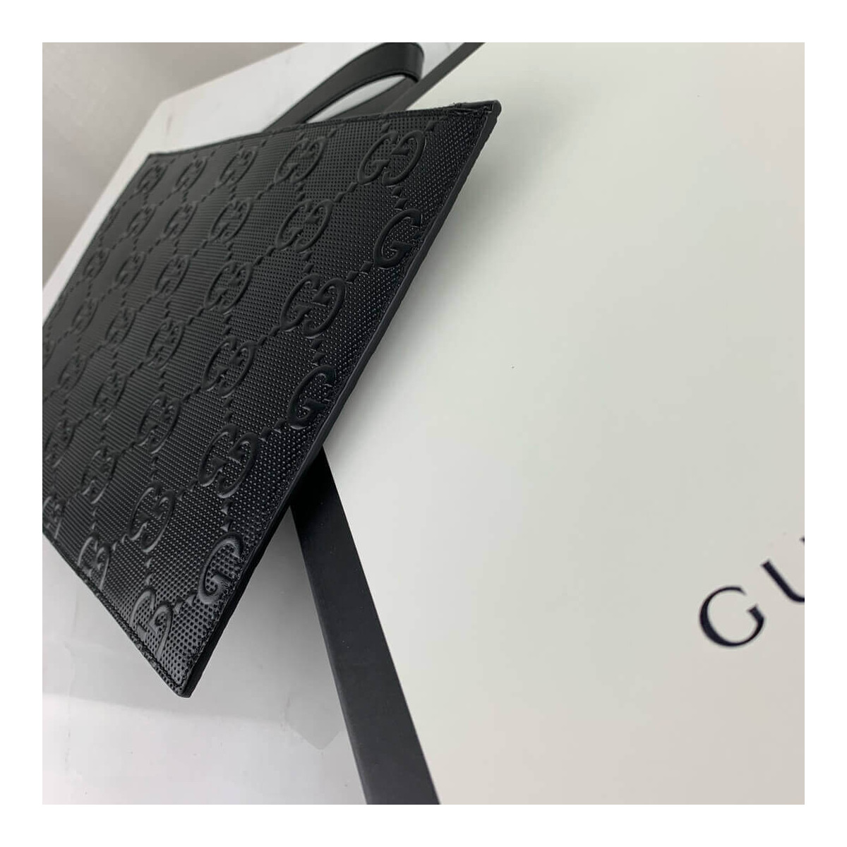 Gucci GG Embossed Pouch 625569