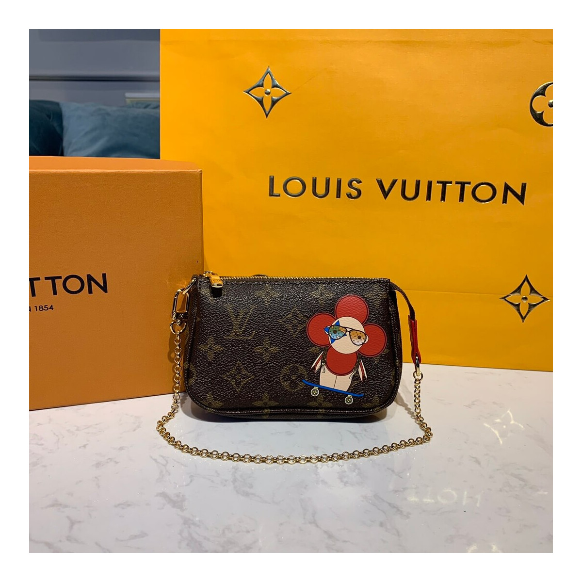 Louis Vuitton Vivienne Mini Pochette Accessoires M69056